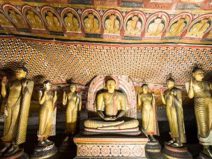 Amazing view of lot Buddhas statues and religious carving inside cave in sacred Golden Temple. Dambulla, Sri Lanka travel destinations