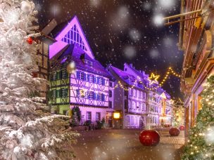 Traditional Alsatian half-timbered houses in old town of Colmar, decorated and illuminated at christmas time, Alsace, France