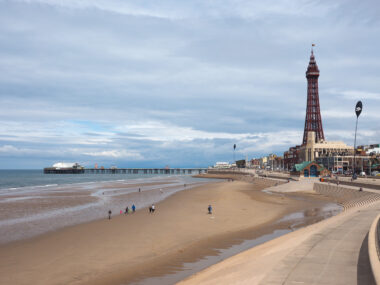 BLACKPOOL, UK - CIRCA JUNE 2016: Blackpool Pleasure Beach resort and Blackpool Tower on the Fylde coast in Lancashire