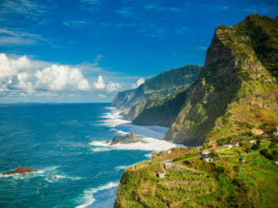 beautiful view of rocky cliffs and ocean on the northern coast of Madeira near Boaventura, Portugal