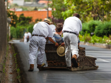 Toboggan riders on sledge in Monte - Funchal Madeira island - Portugal